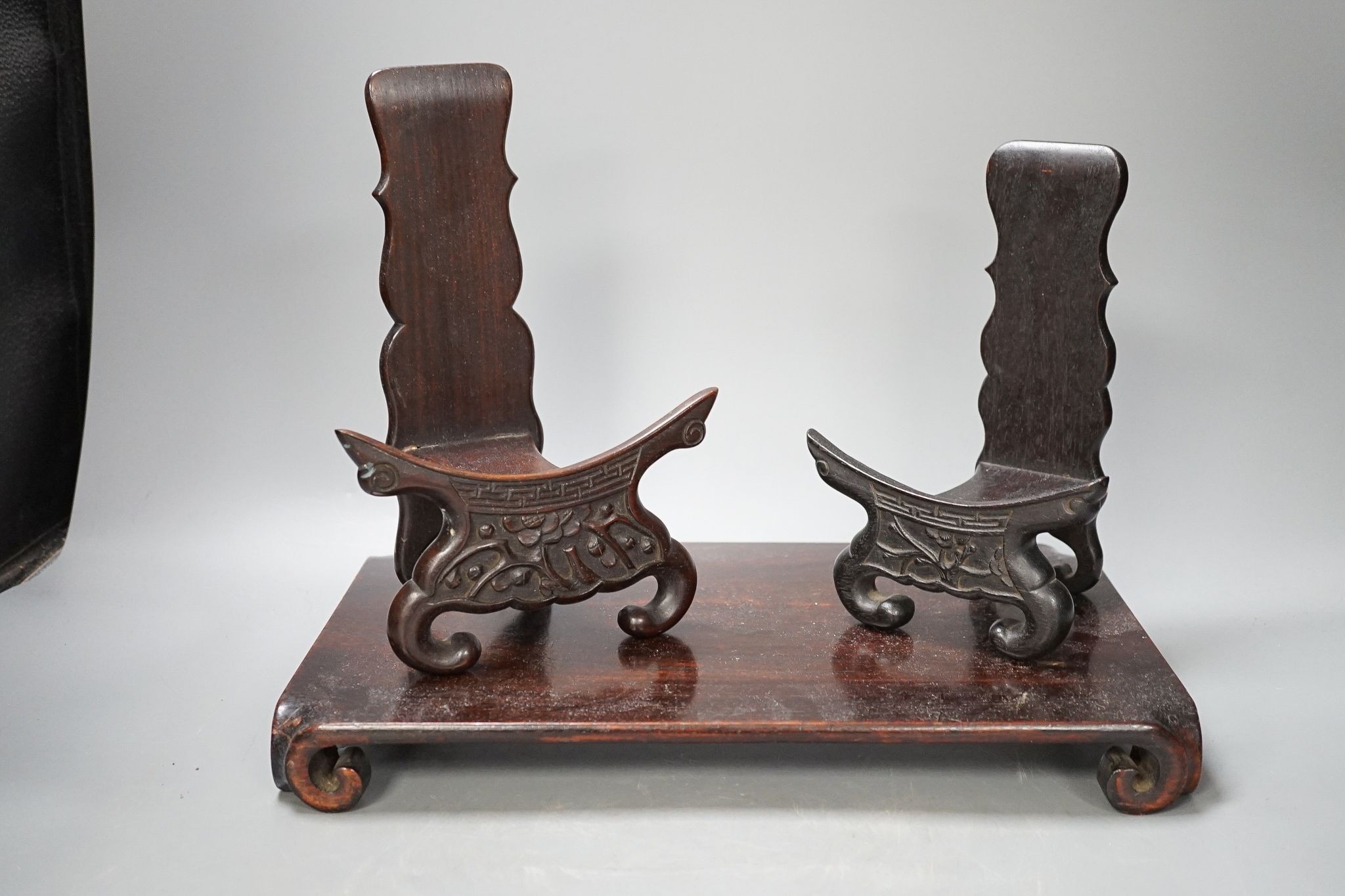 Two Chinese hardwood low stands and two similar plate stands, largest 36cm